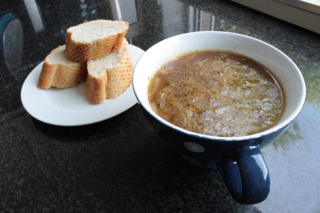 French onion soup and a fresh baguette - Food Photography